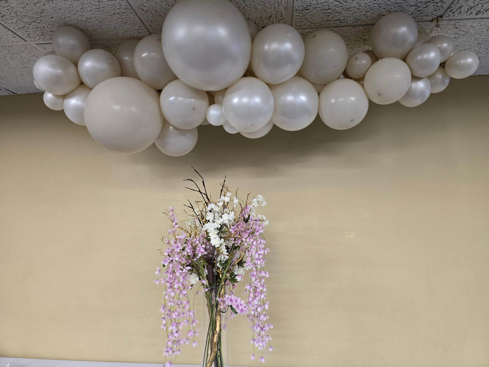 Cream cloud balloon display with florals by Simone's Creations DMV