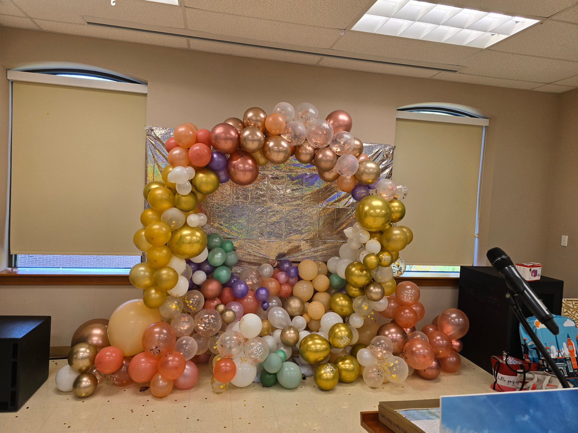 Rose gold shimmer wall with balloon arch installation by Simone's Creations DMV